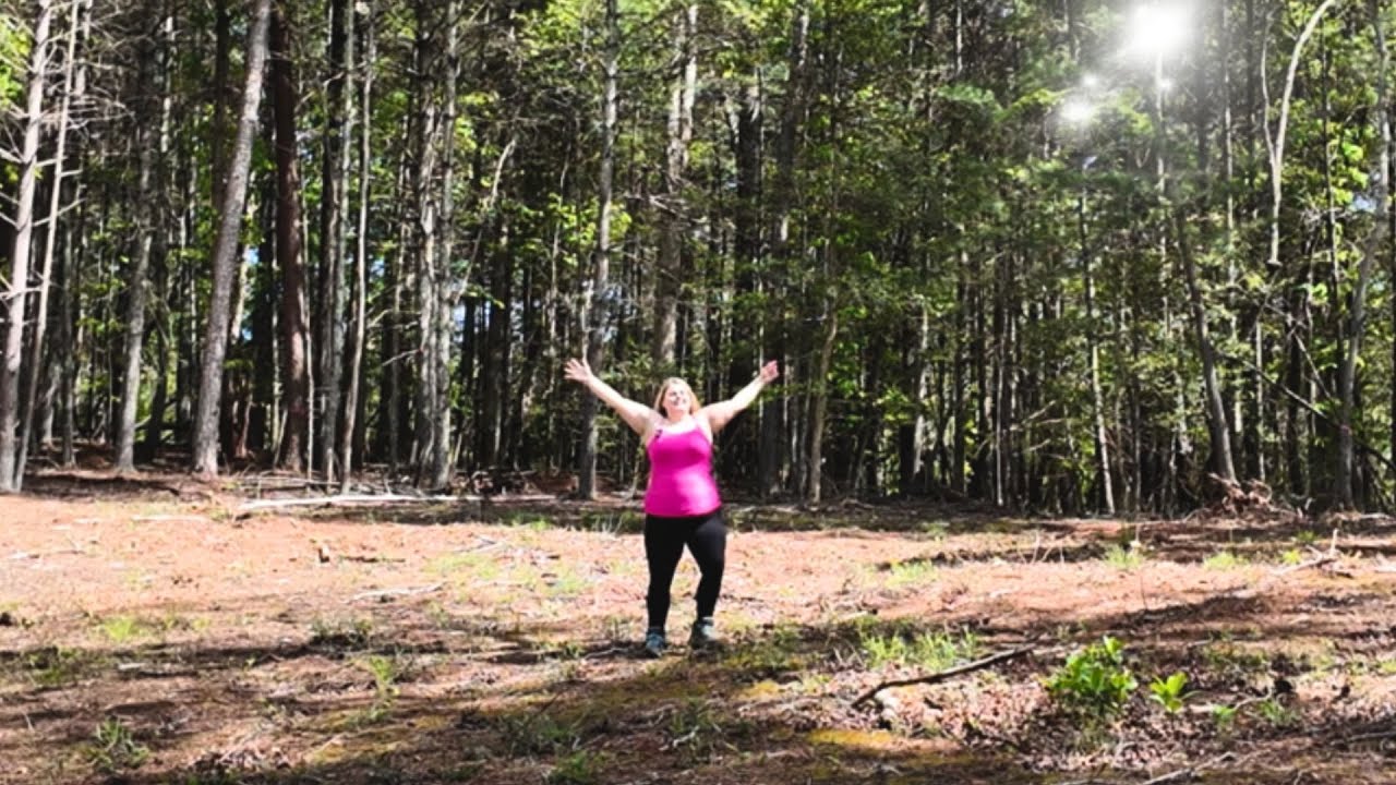 Bree on the land, arms raised